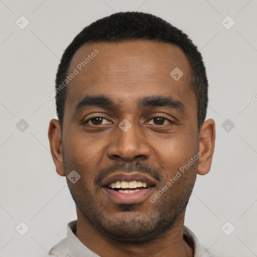 Joyful black young-adult male with short  black hair and brown eyes