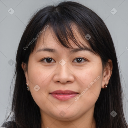 Joyful white adult female with medium  brown hair and brown eyes