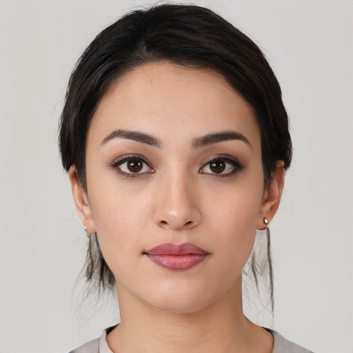 Neutral white young-adult female with medium  black hair and brown eyes