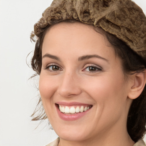 Joyful white young-adult female with medium  brown hair and green eyes