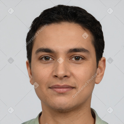 Joyful latino young-adult male with short  black hair and brown eyes