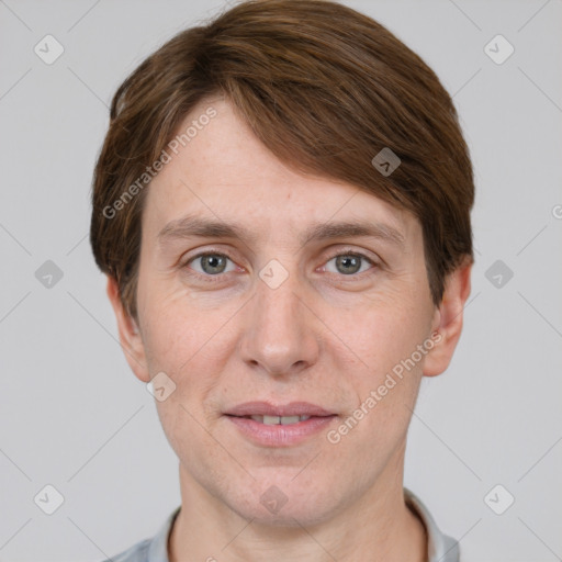 Joyful white adult male with short  brown hair and grey eyes