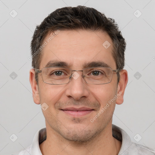 Joyful white adult male with short  brown hair and brown eyes