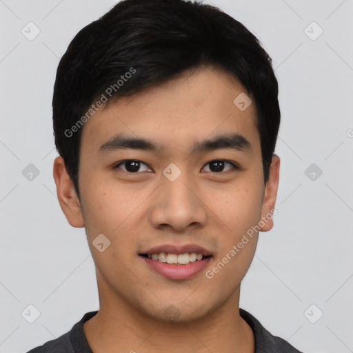 Joyful asian young-adult male with short  black hair and brown eyes