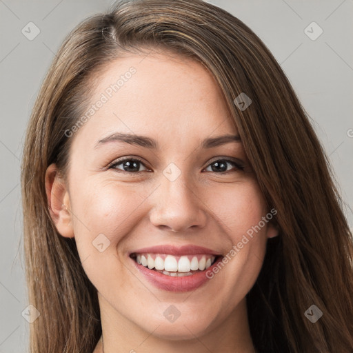 Joyful white young-adult female with long  brown hair and grey eyes