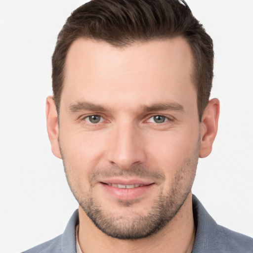 Joyful white young-adult male with short  brown hair and brown eyes