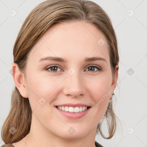 Joyful white young-adult female with medium  brown hair and blue eyes