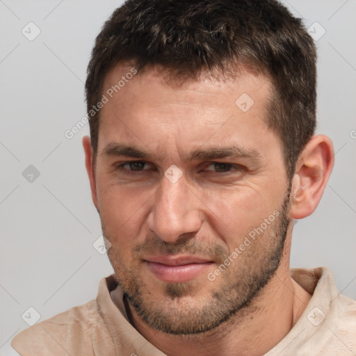 Joyful white adult male with short  brown hair and brown eyes