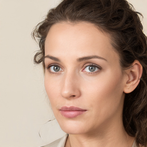 Neutral white young-adult female with medium  brown hair and green eyes