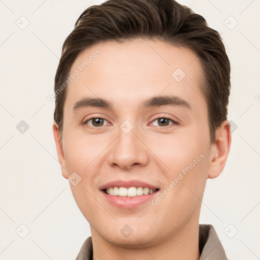 Joyful white young-adult male with short  brown hair and brown eyes