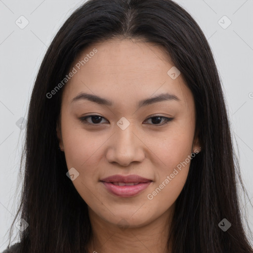 Joyful asian young-adult female with long  brown hair and brown eyes