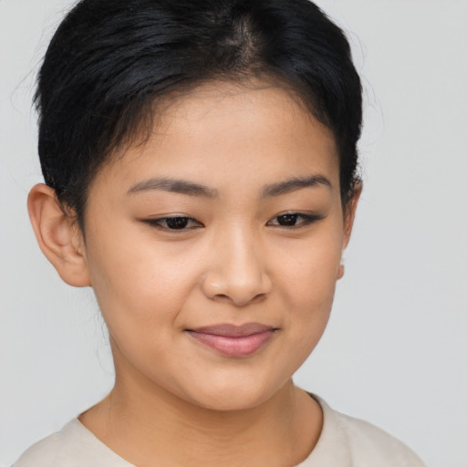 Joyful asian young-adult female with short  brown hair and brown eyes