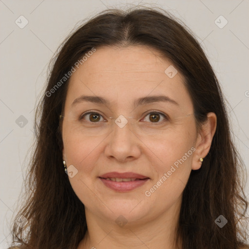 Joyful white adult female with long  brown hair and brown eyes