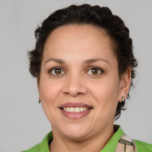 Joyful white adult female with short  brown hair and brown eyes