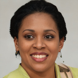 Joyful latino young-adult female with short  brown hair and brown eyes