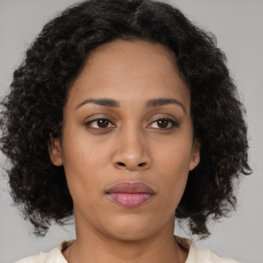 Neutral latino young-adult female with medium  brown hair and brown eyes
