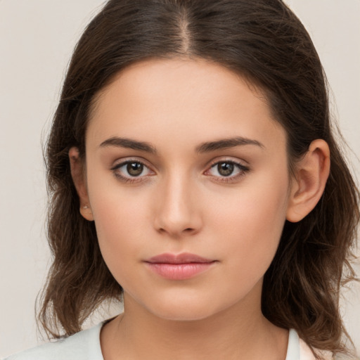 Neutral white young-adult female with long  brown hair and brown eyes