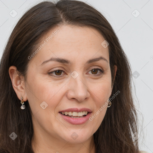 Joyful white adult female with long  brown hair and brown eyes