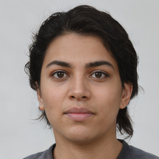 Neutral latino young-adult female with medium  brown hair and brown eyes