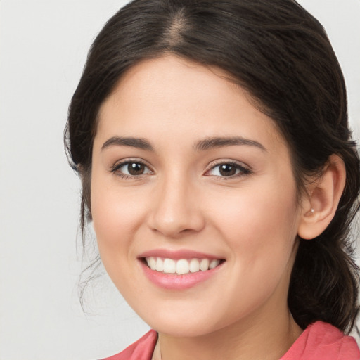 Joyful white young-adult female with medium  brown hair and brown eyes