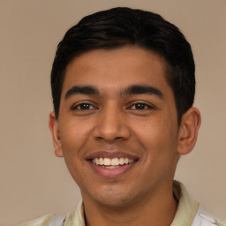 Joyful latino young-adult male with short  black hair and brown eyes