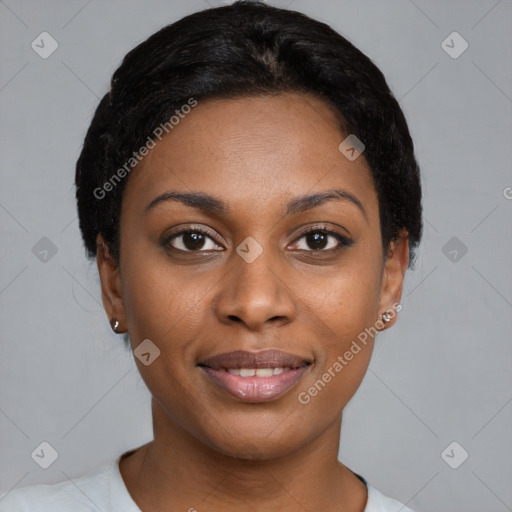 Joyful black young-adult female with short  black hair and brown eyes