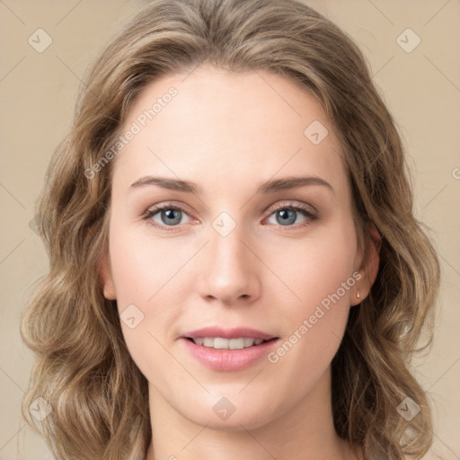 Joyful white young-adult female with long  brown hair and green eyes