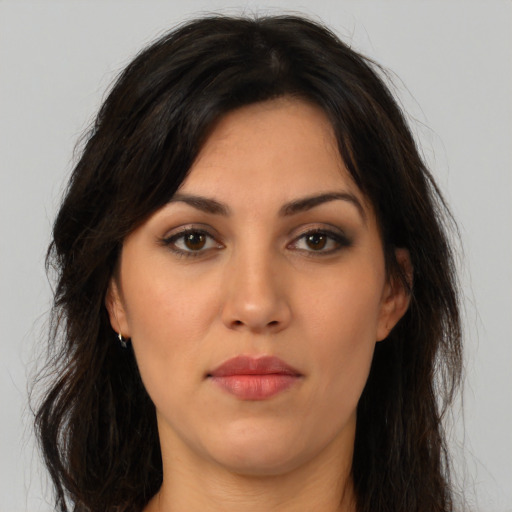 Neutral latino young-adult female with medium  brown hair and brown eyes