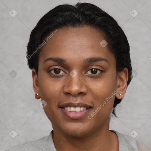 Joyful black young-adult female with short  black hair and brown eyes