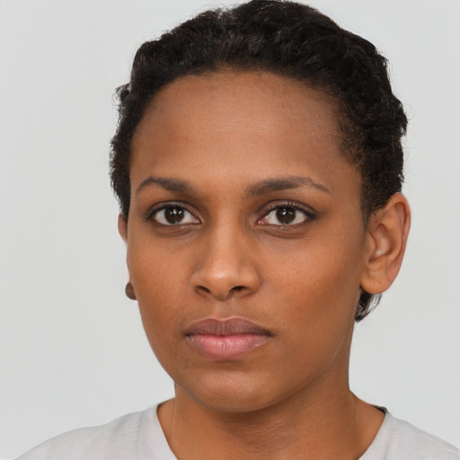 Neutral black young-adult female with short  brown hair and brown eyes