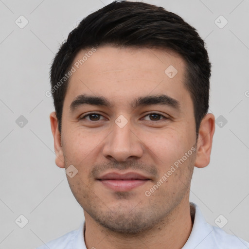 Joyful white young-adult male with short  black hair and brown eyes