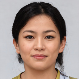 Joyful asian young-adult female with medium  brown hair and brown eyes