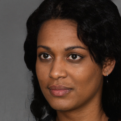 Neutral black young-adult female with long  black hair and brown eyes