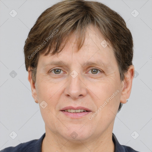 Joyful white adult male with short  brown hair and grey eyes