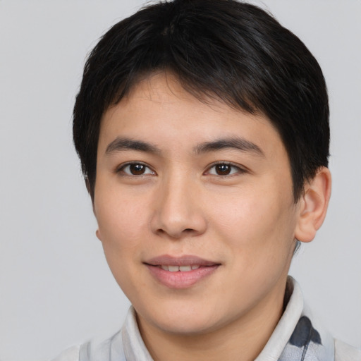 Joyful asian young-adult male with short  brown hair and brown eyes