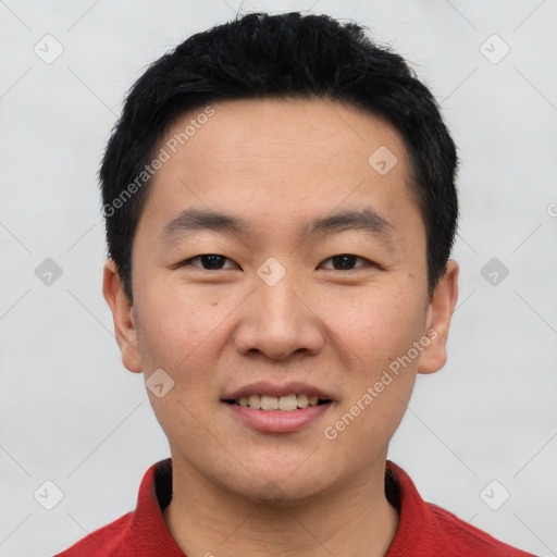 Joyful asian young-adult male with short  black hair and brown eyes