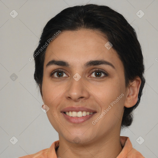 Joyful latino young-adult female with medium  black hair and brown eyes