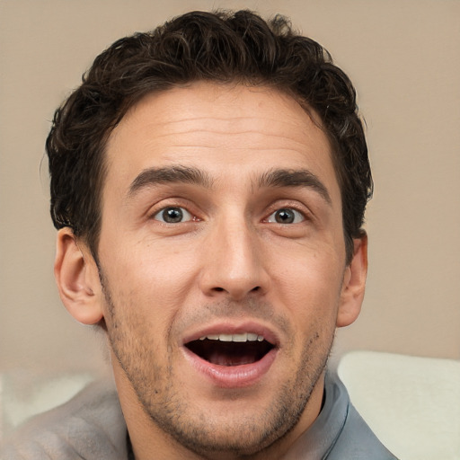 Joyful white adult male with short  brown hair and brown eyes