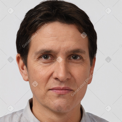 Joyful white adult male with short  brown hair and brown eyes