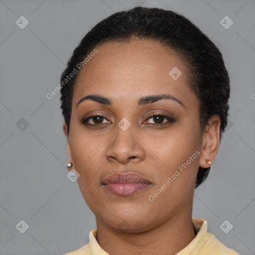 Joyful latino young-adult female with short  black hair and brown eyes