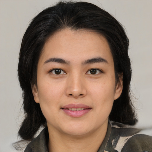 Joyful asian young-adult female with medium  brown hair and brown eyes