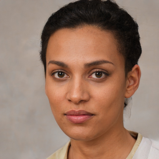 Neutral white young-adult female with short  brown hair and brown eyes