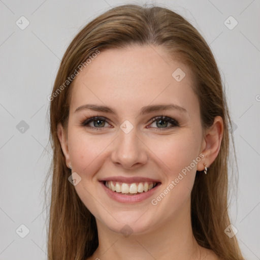 Joyful white young-adult female with long  brown hair and grey eyes