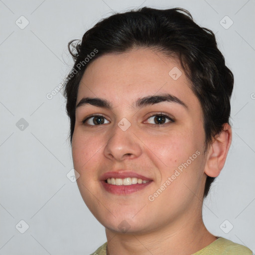 Joyful white young-adult female with short  brown hair and brown eyes