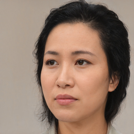 Neutral white adult female with medium  black hair and brown eyes