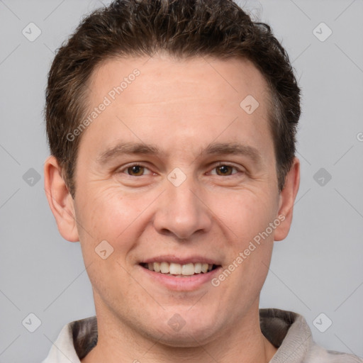 Joyful white adult male with short  brown hair and grey eyes