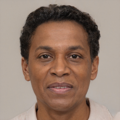 Joyful latino adult male with short  black hair and brown eyes