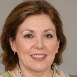 Joyful white adult female with medium  brown hair and grey eyes