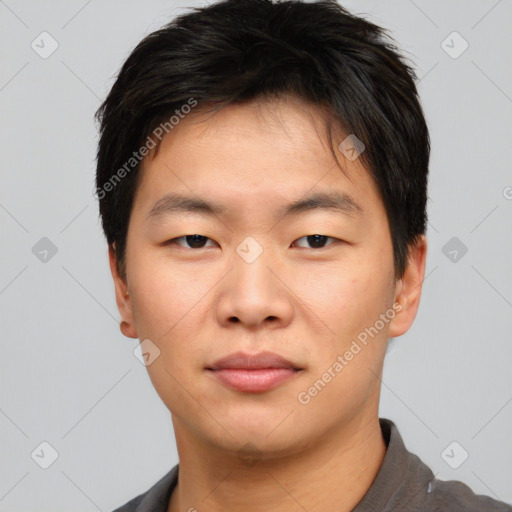 Neutral asian young-adult male with short  brown hair and brown eyes