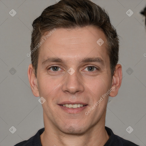 Joyful white adult male with short  brown hair and brown eyes